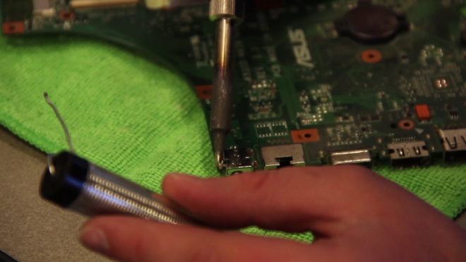 Michael Fixing a Laptop's Power Port